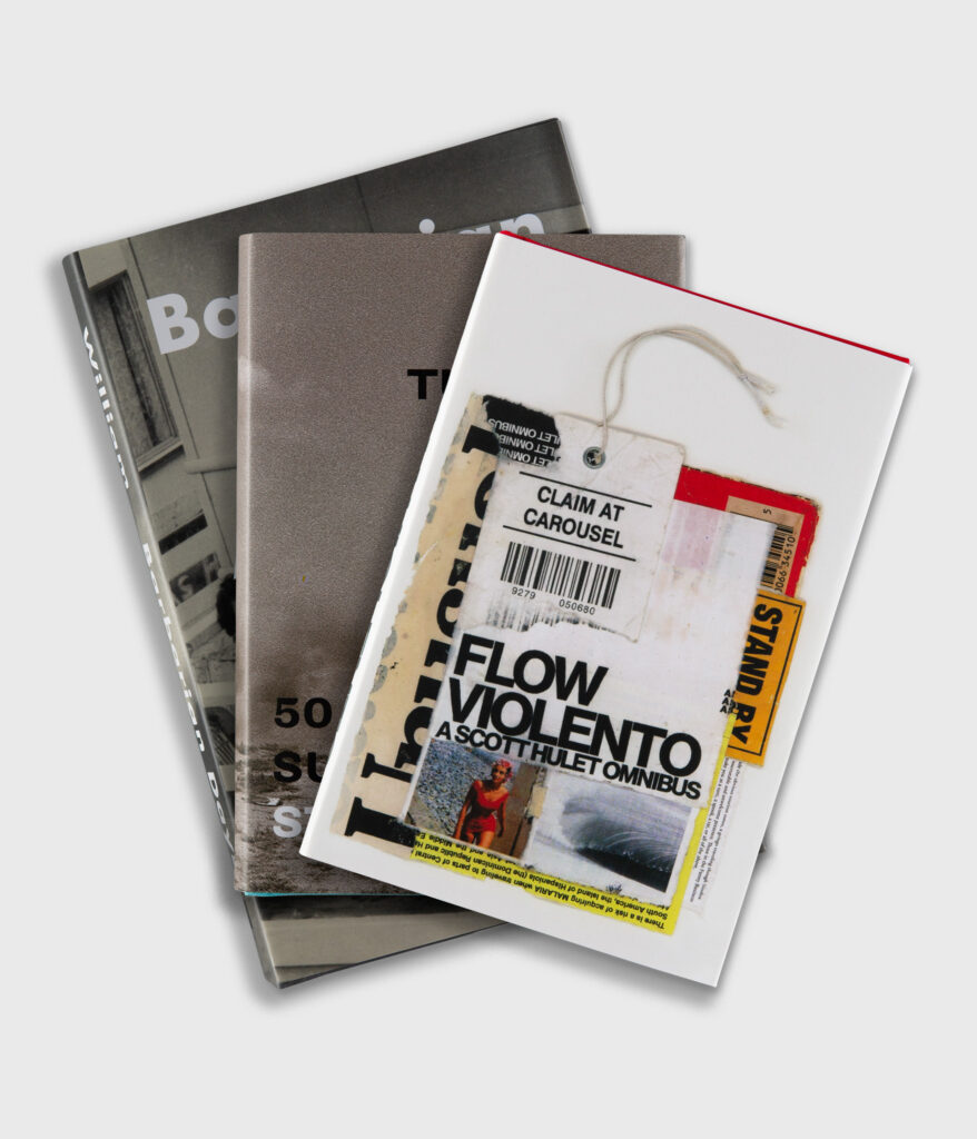 Flow Violento: A Scott Hulet Omnibus by Scott Hulet, Turn and Go! 50 Years of Surf Writings by Steve Pezman, and Barbarian Days: A Surfing Life by William Finnegan displayed together.